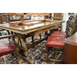 An oak draw leaf refectory dining table.