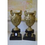 A good pair of ormolu classical urns on marble bases.