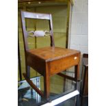 A 19th century fruitwood and elm rocking lambing chair with a drawer to the base.