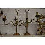 A pair of adjustable twin branch brass candlesticks.