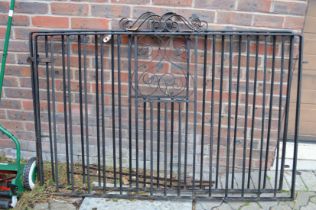 A pair of wrought iron driveway gates, each measuring 4ft 8.5ins wide x 3ft high excluding hanging