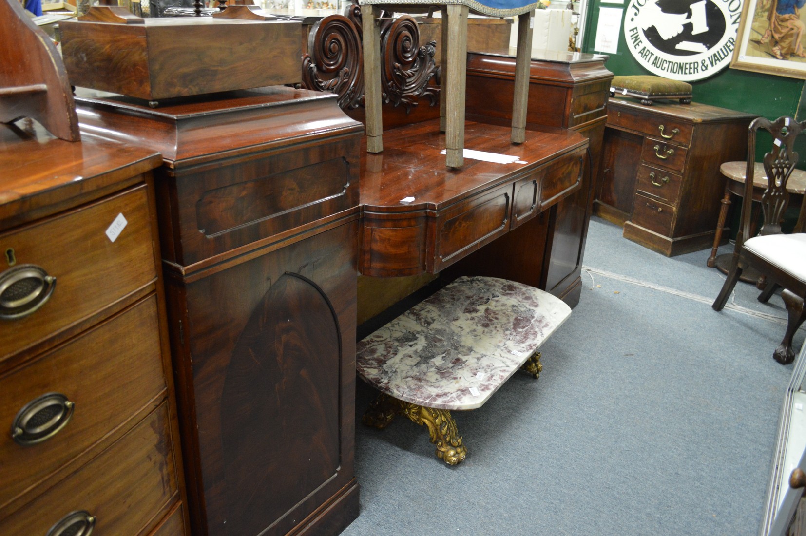 A 19th century mahogany drop centre pedestal sideboard.