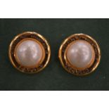 A pair of gilt and pearl ear clips.