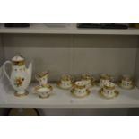 A Royal Doulton floral decorated six place coffee service.