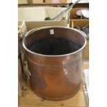 A copper coal bucket.