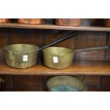 Two brass cooking pans.