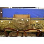 Three embossed brass magazine racks.