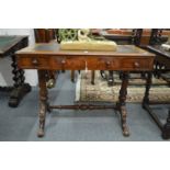 A Victorian walnut three drawer stretcher table.