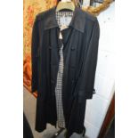 A ladies' Aquascutum navy rain coat.