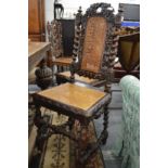 A set of four oak and canework high back dining chairs.