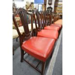 A set of four mahogany shield back dining chairs.