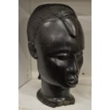 A carved Africa hardwood bust.