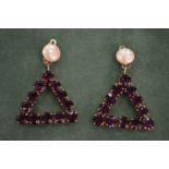 A pair of Lisa Jenkins designer triangle shaped earrings.