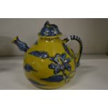 A Chinese yellow ground pottery teapot and cover.