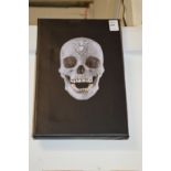 After Damien Hirst, a photographic print on canvas depicting the crystal skull.