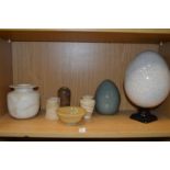 Alabaster jars and other decorative items.