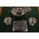 A silver cigarette case and other items.