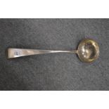 A continental white metal ladle.