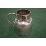 A small silver jug.