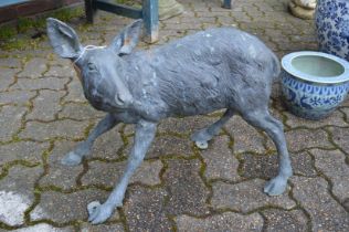 A cast metal model of a deer.