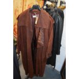 A ladies' plum coloured leather full length coat.
