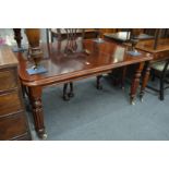 A good mahogany extending dining table with one extra leaf.