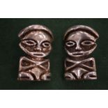 A pair of African figure earrings.