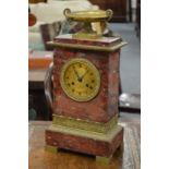 A good Regency rouge marble and ormolu mantle clock with urn finial.