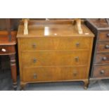 A walnut three drawer chest.