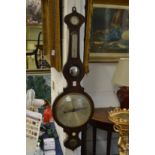 A rosewood cased wheel barometer / thermometer.