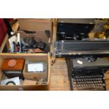 Cameras, an old typewriter, electrical testing equipment etc.