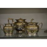 A plated three piece tea service.