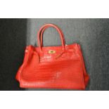 A ladies' red handbag.