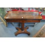 A 19th century rosewood foldover card table.