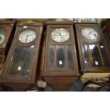 Three various oak cased drop dial wall clocks.