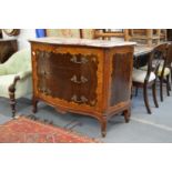 A French style marquetry and marble topped serpentine fronted three drawer commode.