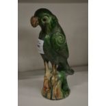 A pottery model of a parrot.