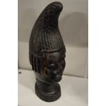 An African carved hardwood bust.