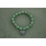 A jadeite bead bracelet.