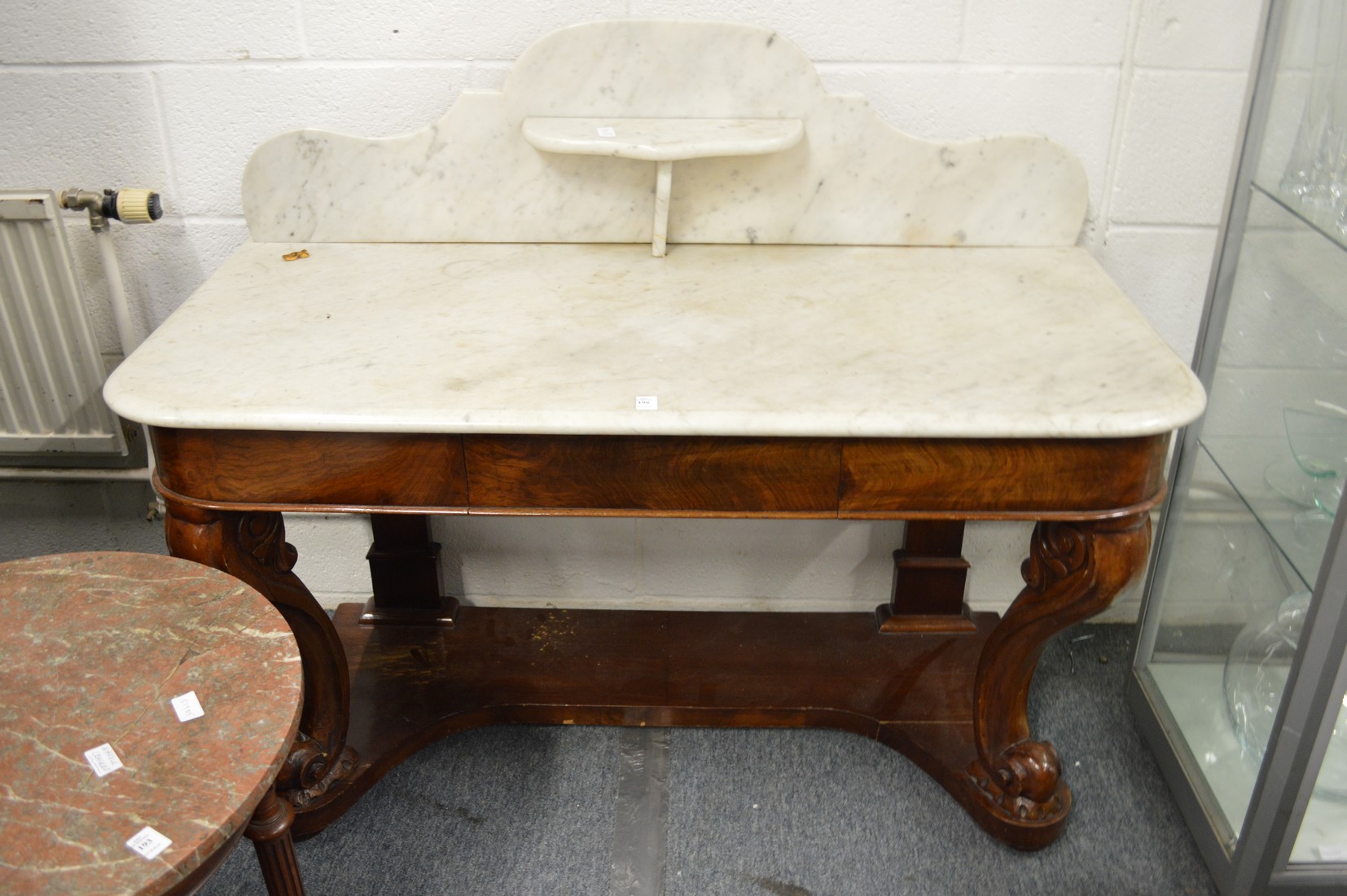 A Victorian mahogany and marble top washstand.