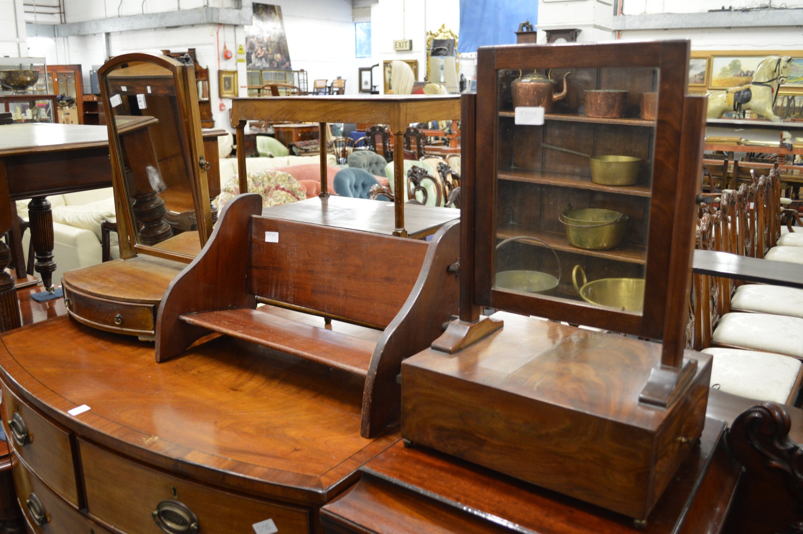 Two dressing table mirrors and a book rack.