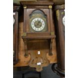 A walnut cased drop dial wall clock.