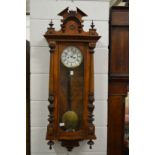 A Victorian walnut Vienna style regulator wall clock.