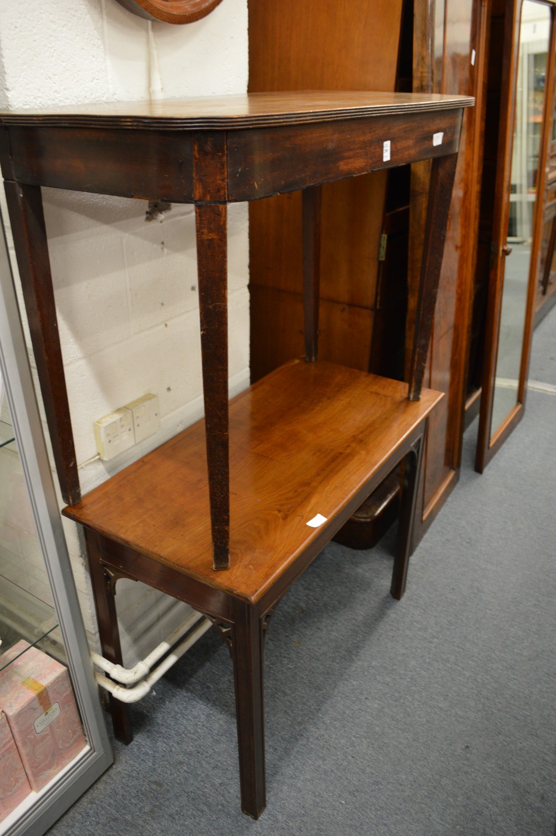 Two mahogany side tables.