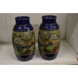 A pair of continental landscape vases.