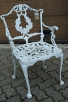 A white painted cast aluminium armchair.