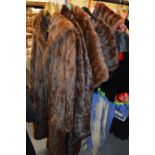 Five various fur coats, jackets and stoles.