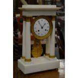 A good white marble and ormolu Portico mantle clock.
