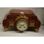 A 19th century French rouge marble and ormolu mounted clock.