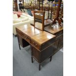 A George III mahogany gentleman's dressing table with rise and fall mirror.